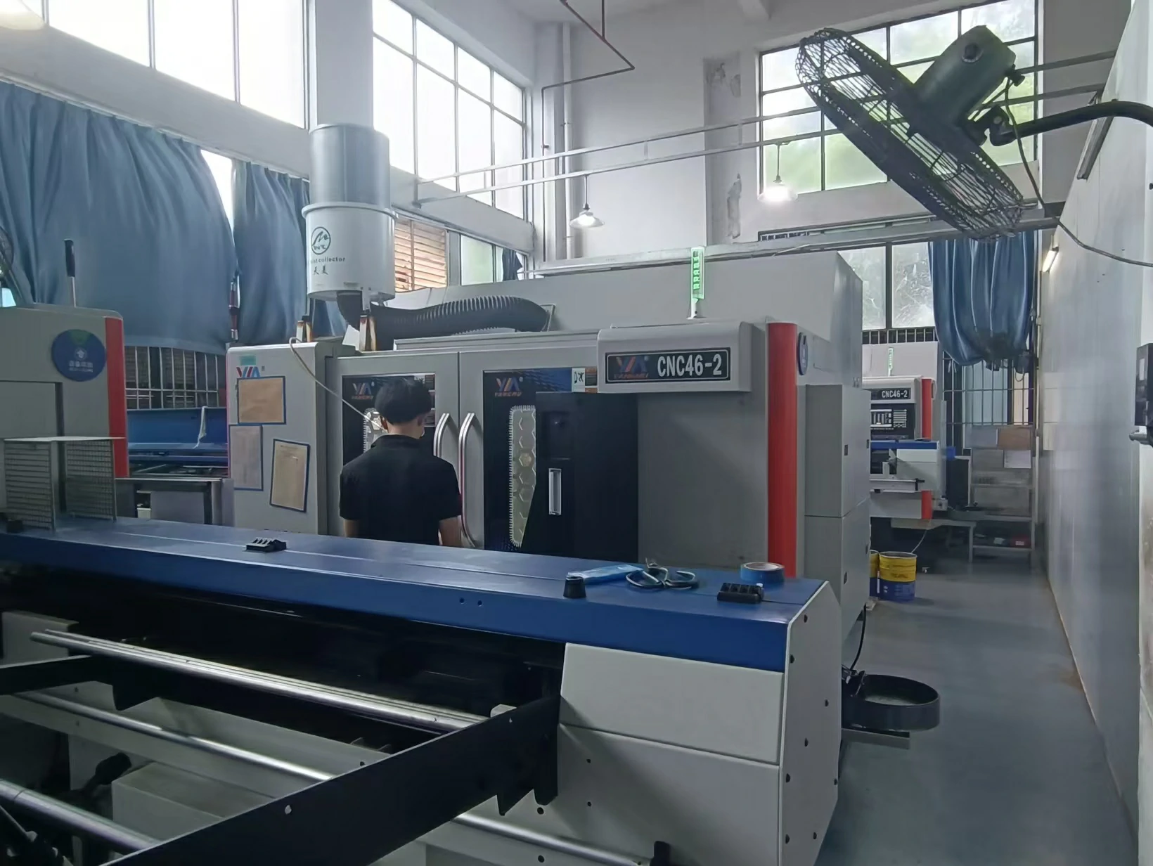 Altus Precision engineer reviewing drawings at the production line